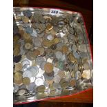 Large quantity of foreign coins in a tin