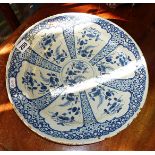 An 18th c. Bristol Delft charger (A/F with rivets), 14" diameter