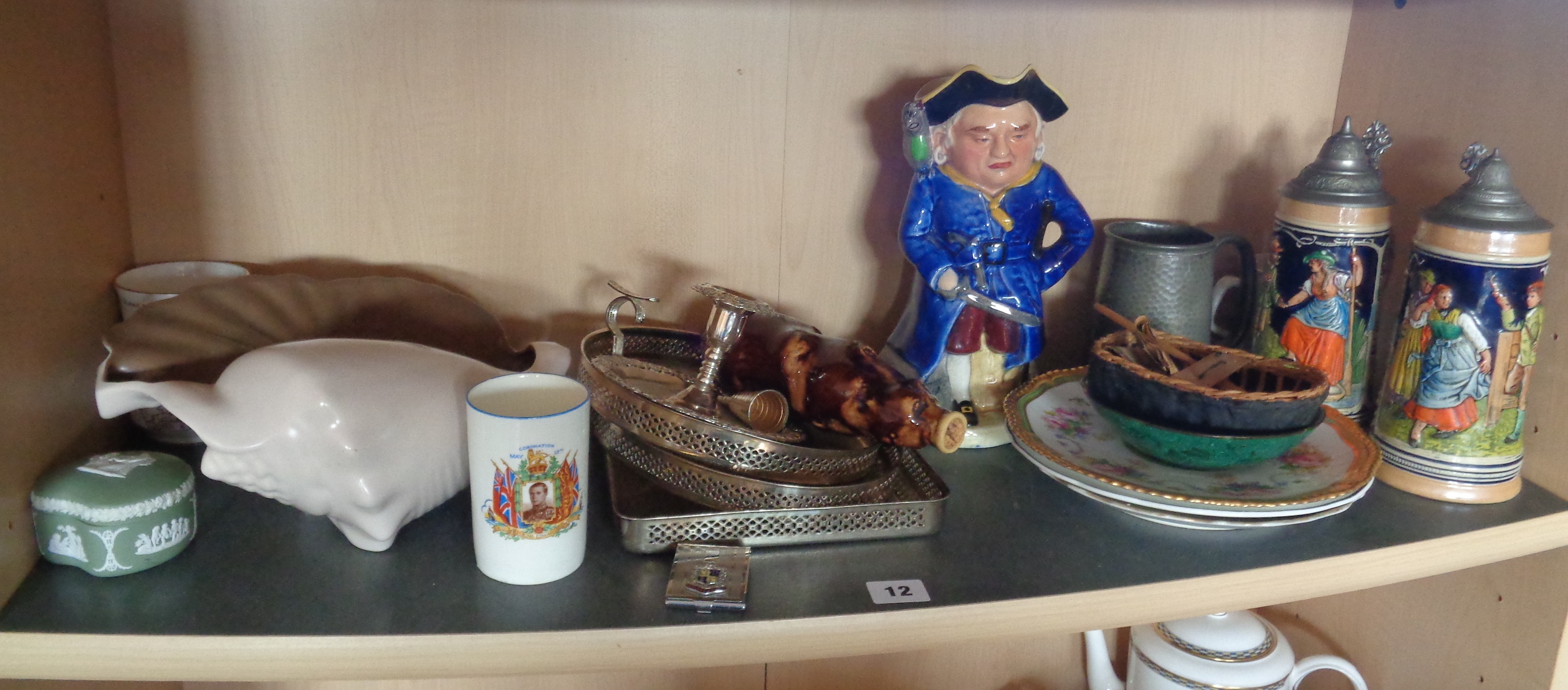 Shelf of assorted china etc. inc. musical Toby Jug Long John Silver, Poole Pottery shell, King