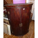 Georgian bow fronted mahogany corner cupboard