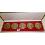A cased presentation set of five large figural bronze medallions commemorating the Portuguese Navy