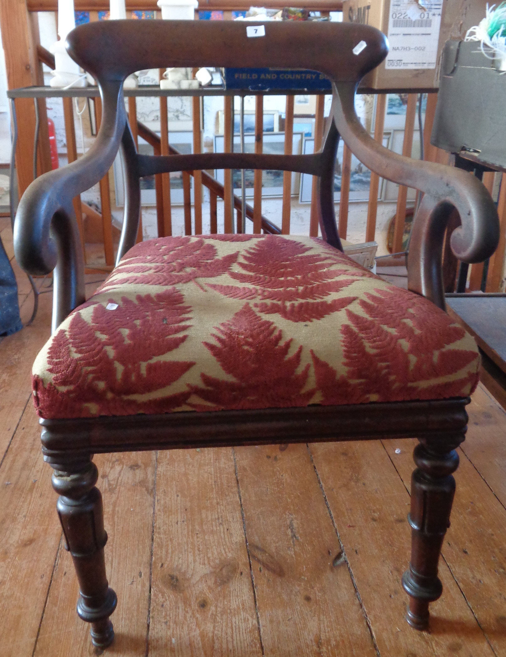 19th c. mahogany scroll-arm library elbow chair on turned and carved legs