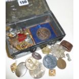 Collection of badges and medallions in cash box, some military