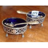 Pair of oval silver salts, London 1896, with blue glass liners and silver spoons having front and