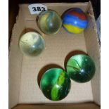 Five large glass marbles