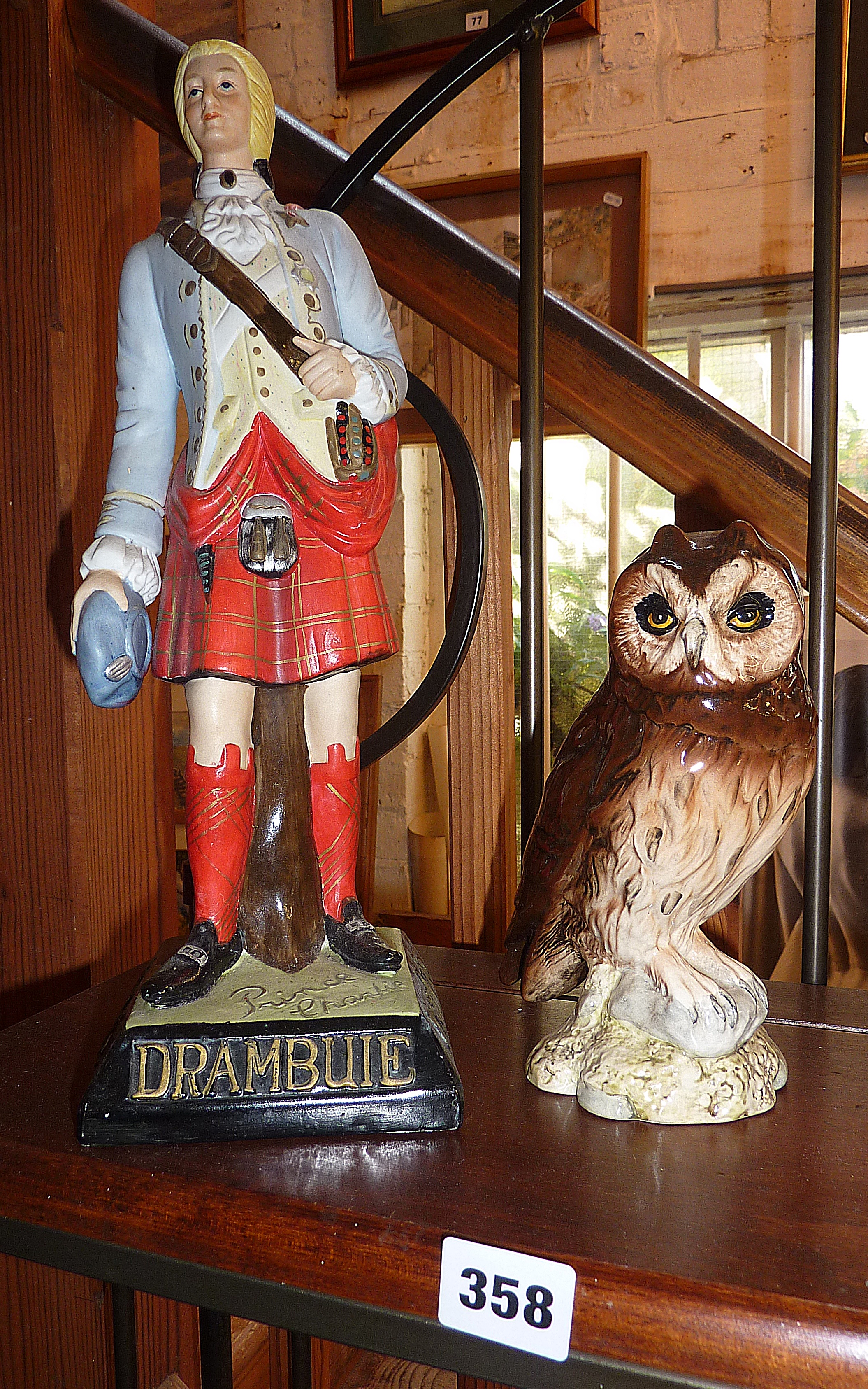 Beswick short eared owl and a Drambuie "Prince Charlie" porcelain figure
