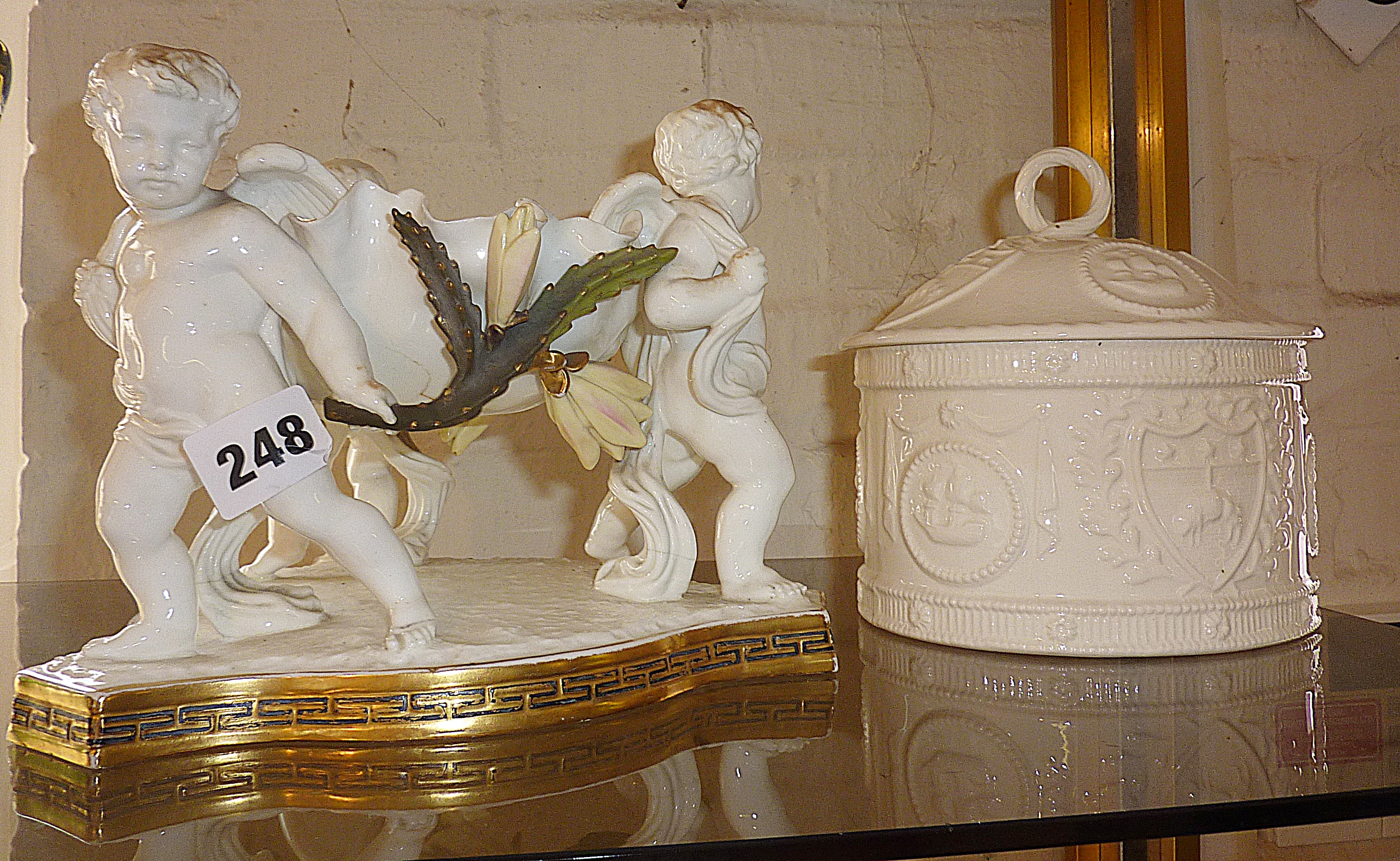 19th c. English porcelain centrepiece of three cupids supporting a scalloped bowl (A/F) and a