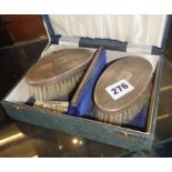 Cased pair of gentleman's silver backed hairbrushes