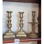 Pair Victorian brass candlesticks and a similar brass candlestick with drip pan