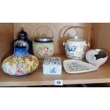 Four pieces of Poole Pottery, inc. biscuit barrel and three others