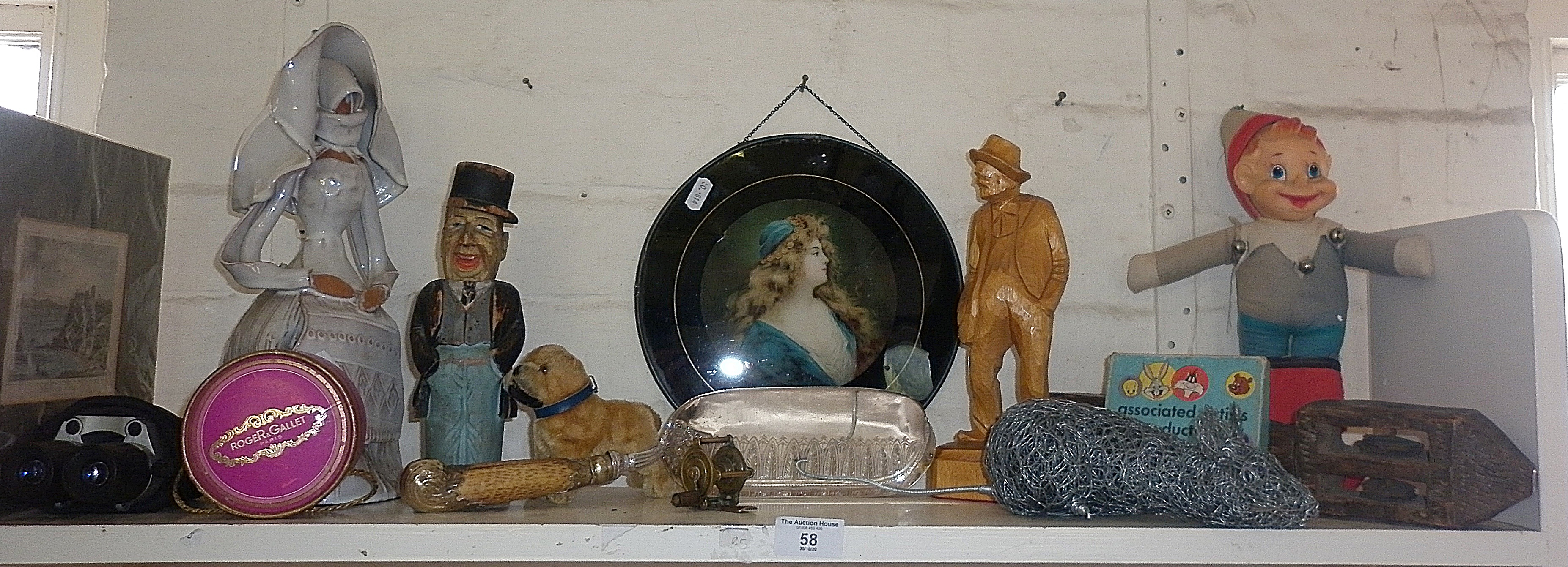 Shelf of assorted items including humorous painted carved figure etc