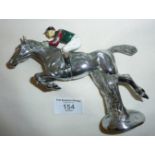 Vintage chrome car mascot in the form of a painted jockey on a jumping racehorse