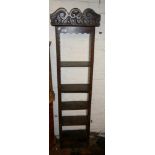Early 19th c. narrow oak bookshelf with carved pediment over