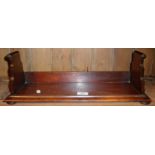 Regency mahogany book rack with stepped and scrolled ends, 20" long