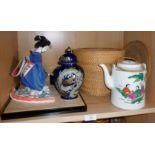 Glass cased Geisha tea girl doll, a vase and a Chinese teapot in basket