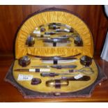 Edwardian leather manicure set with fitted interior and mirror to lid