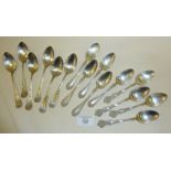 Set of six silver teaspoons with engraved rose pattern marked as Sterling, four silver teaspoons