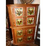 Pair of pine corner cupboards with Art Nouveau tile decoration