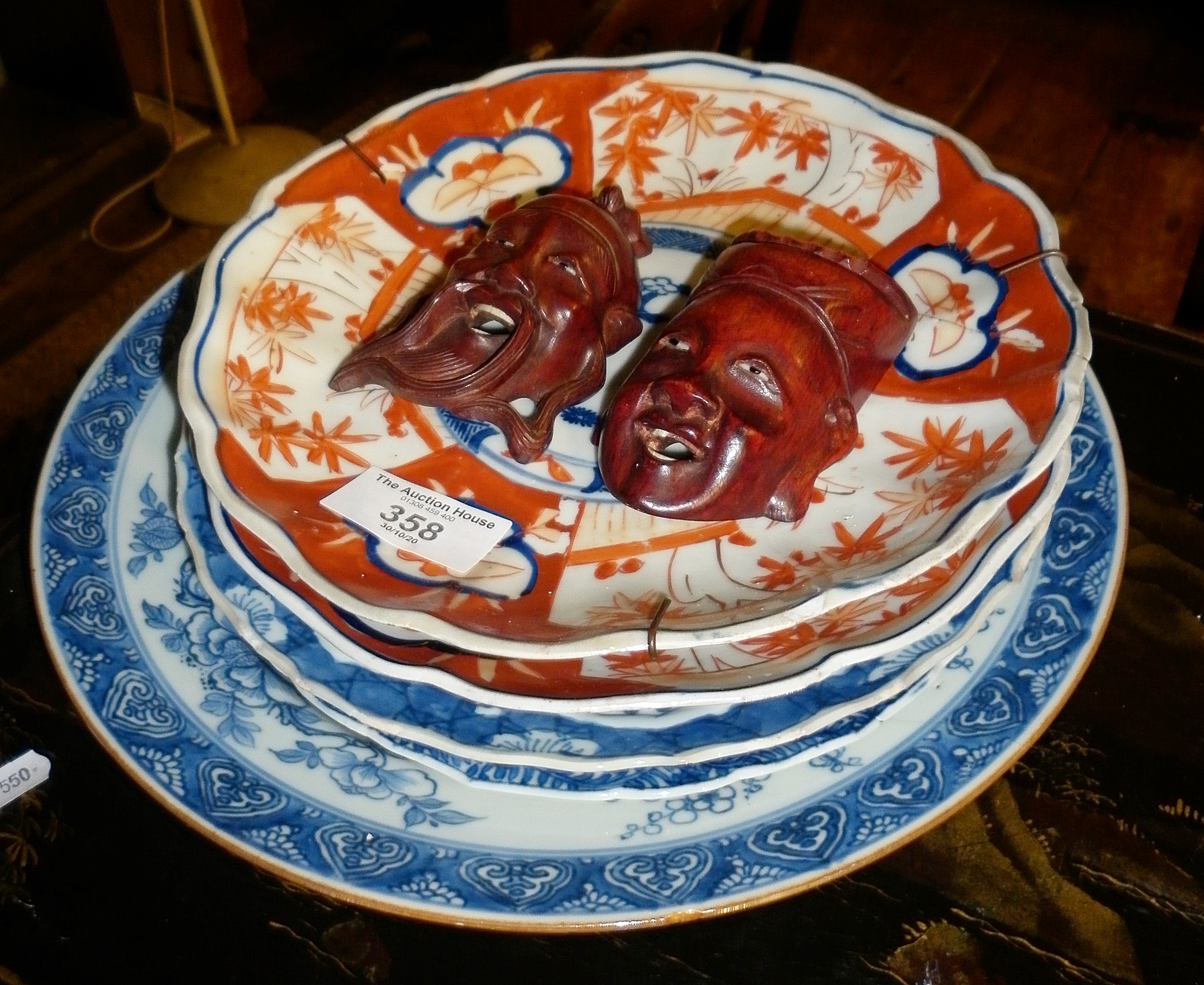 Two Imari plates, three Chinese blue and white plates and two small Oriental carved hardwood wall