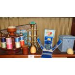 Sewing items including bobbin and thread holders, and a 1920's silk needlecase and needle holder