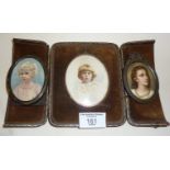 Edwardian cased portrait miniature of a child, another signed miniature of a child and metal