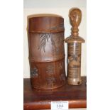 Chinese carved wooden brush pot and a carved figural scroll holder