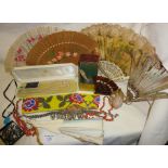 Box containing perfume bottles, Native American beadwork belt, antique fans, necklaces including