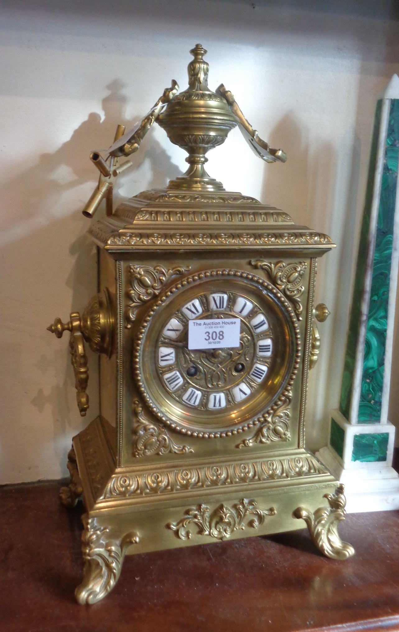 19th c. French ormolu mantle clock having brass dial with enamel numerals