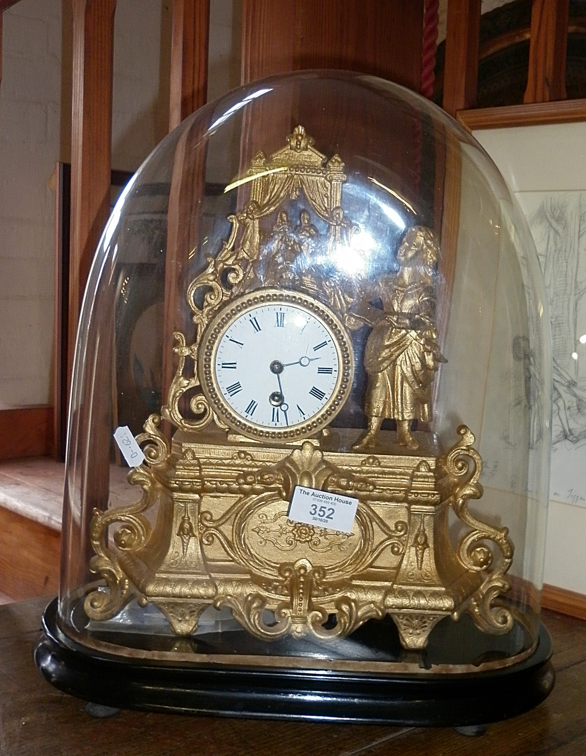 19th c. French gilt mantle clock, under dome, surmounted by figure of a girl directing a play with