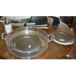 Two 18th century pewter plates, a round galleried silver plated tray and a sugar sifter