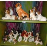Two shelves of china dog ornaments