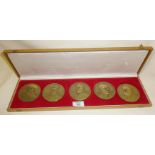 A cased presentation set of five large figural bronze medallions commemorating the Portuguese Navy