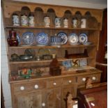 Large Victorian pine kitchen dresser having four shelves above four drawers with china knobs and two