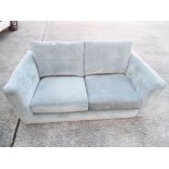 A modern two seater upholstered sofa Thi