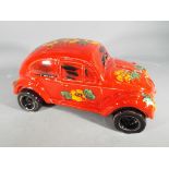Anita Harris - a hand painted ceramic depiction of a VW Beetle car,