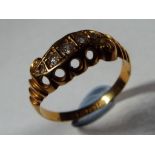 18 ct - Lady's 18 carat hallmarked yellow gold ring set with five diamonds size K,