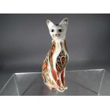 Royal Crown Derby - a paperweight depicting a Siamese cat,