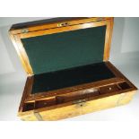 A 19th century brass bound walnut writing slope with fitted interior,
