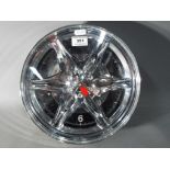 A novelty clock in the form of an alloy wheel,
