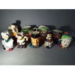 A collection of character jugs, Toby jugs and similar to include Beswick, Sylvac and others.