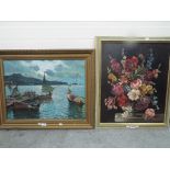 Two framed oils, the first a still life oil on canvas of flowers,