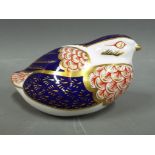 A Royal Crown Derby paperweight in the style of a quail,