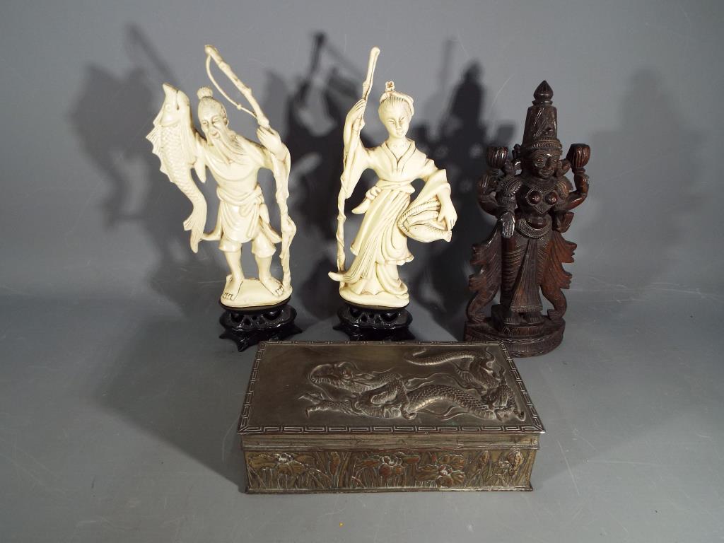 Two Oriental figurines,