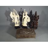 Two Oriental figurines,