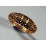 18 ct - a 18 carat hallmarked gold ring set with five diamonds, size K1/2 approximate weight 2.