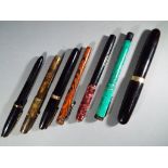 A collection of fountain pens to include a Waterman's 515, the Champion Pen,