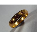 22 ct - a 22 carat gold wedding band set with 3 rubies size K, approximate weight 3.