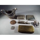 A collection of collectable items to include a plated creamer,
