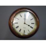 A quartz wall clock, the dial scribed 'Spectrum' mounted on an oak frame,