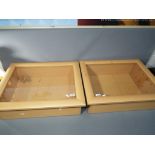 Two modern good quality table top glass fronted display cases,